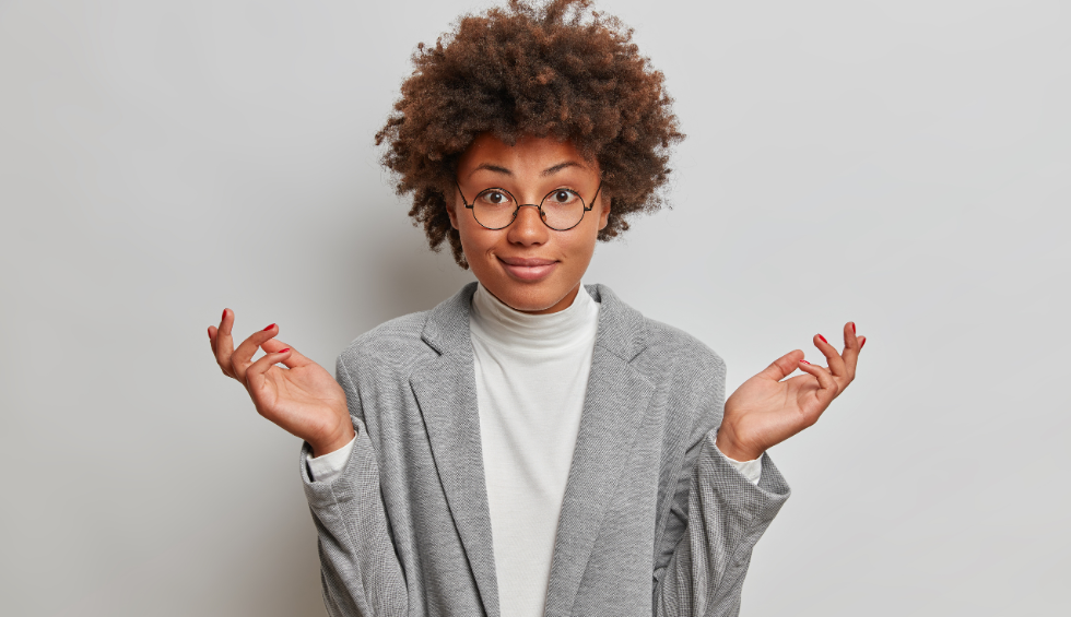 Confident woman shrugging with a knowing smile, symbolizing curiosity and intrigue—highlighting why Black Tuna weed stands out