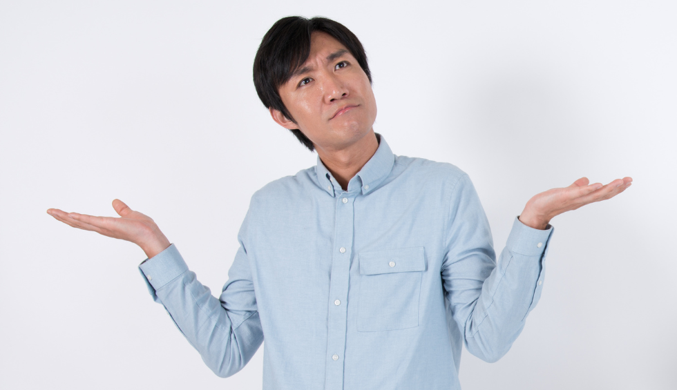 Confused man shrugging with raised hands—representing curiosity about online pot shops in Canada
