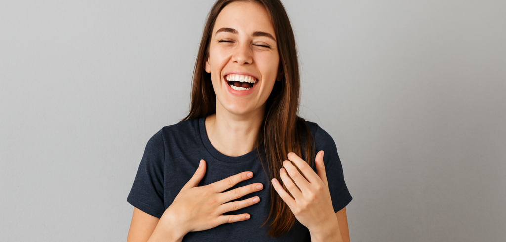Woman laughing joyfully with eyes closed, expressing the uplifting and euphoric effects of quality weed