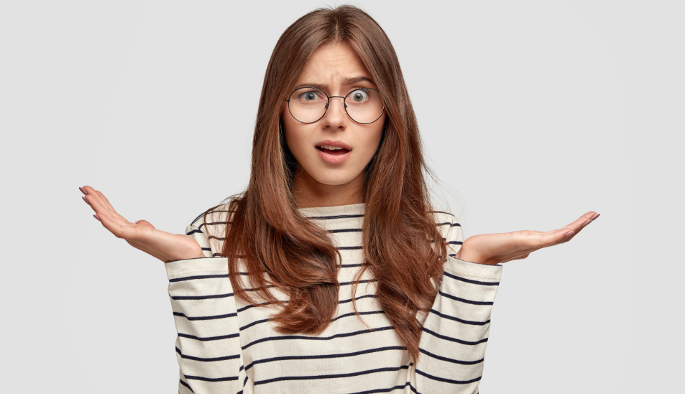 Confused woman with raised hands, expressing curiosity or surprise, representing questions about the popularity of rosin products