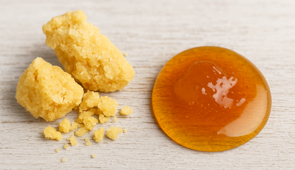 Yellow cannabis crumble and amber THC concentrate on a light wooden surface, showing different types of bulk concentrates in Canada