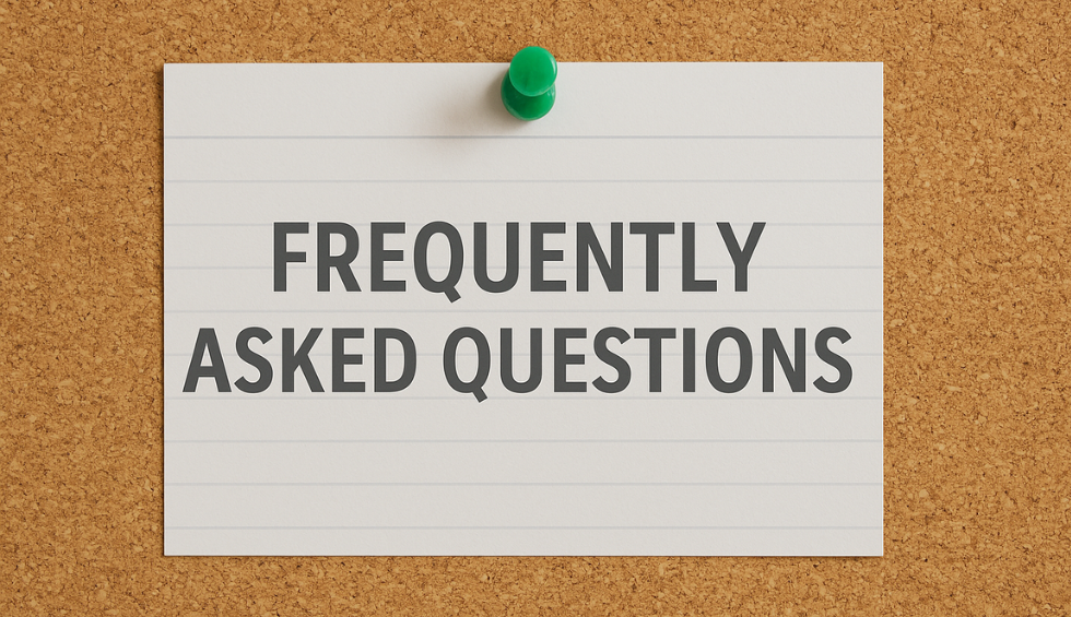 Note card pinned to a corkboard with the text “Frequently Asked Questions” in bold black letters
