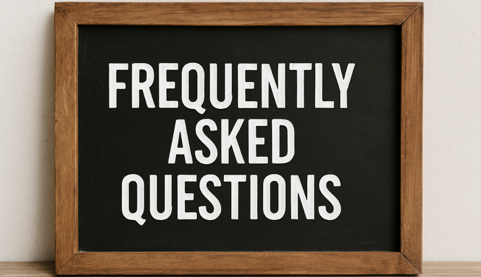 Wooden frame chalkboard sign with the words Frequently Asked Questions in white letters