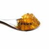 Apple Fritter cannabis caviar extract on spoon with golden terpene-rich oil