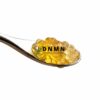 Island Sweet Skunk cannabis caviar on spoon with light golden terpene oil